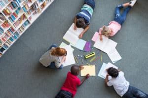 kids-drawing-and-writing-in-classroom