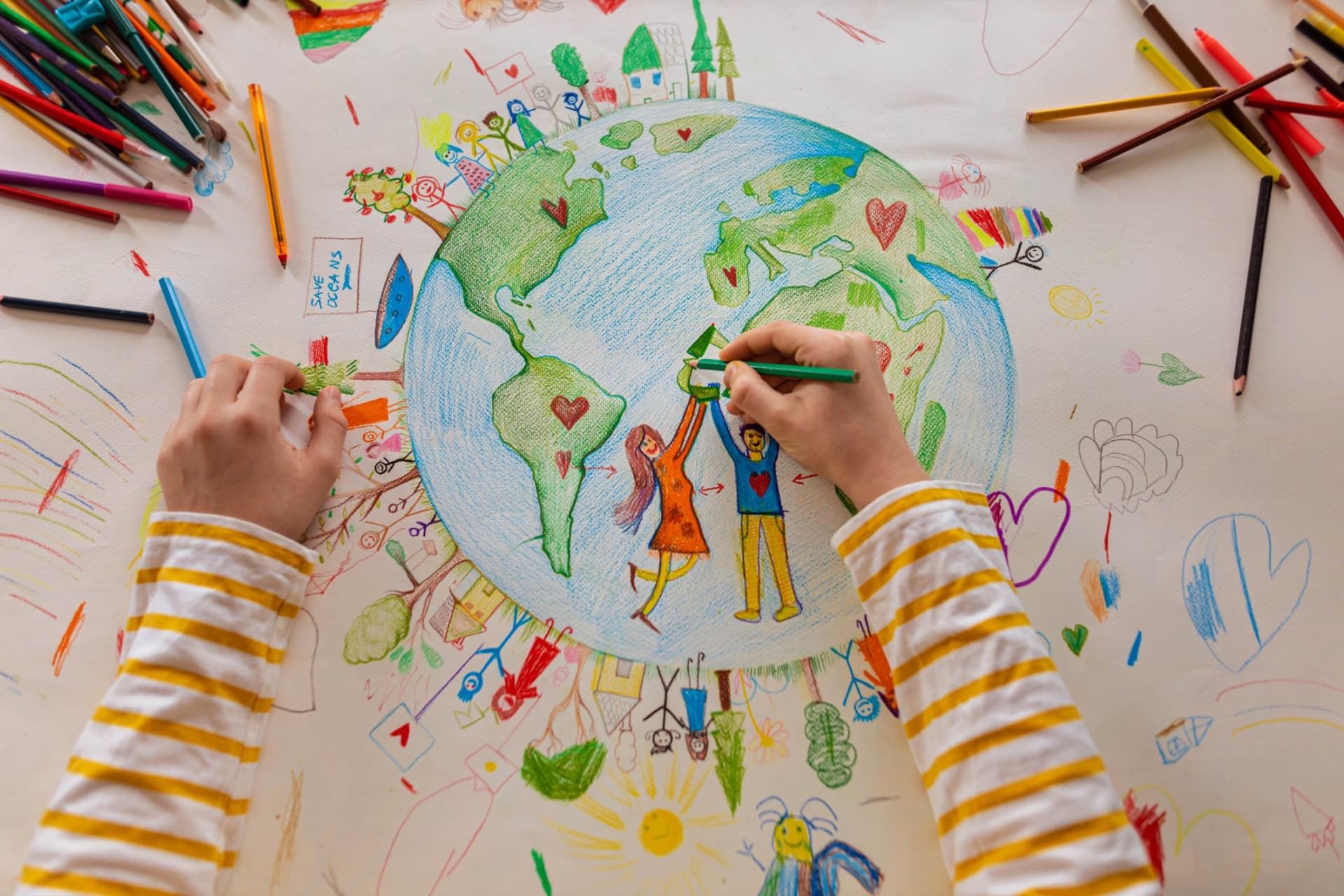 This is a photo of a 5th-grade student drawing a picture of the earth.