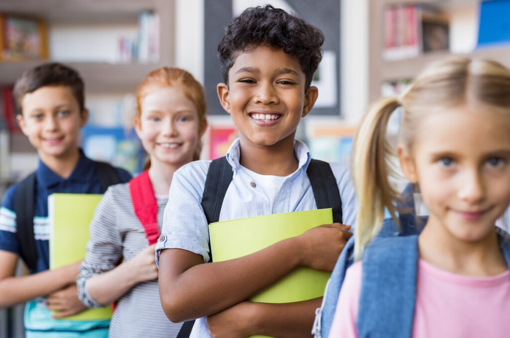 student-success-goal-setting-in-line-smiling holding-folder