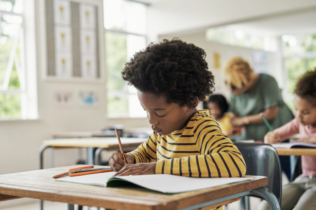 student-sel-writing-assignment-desk